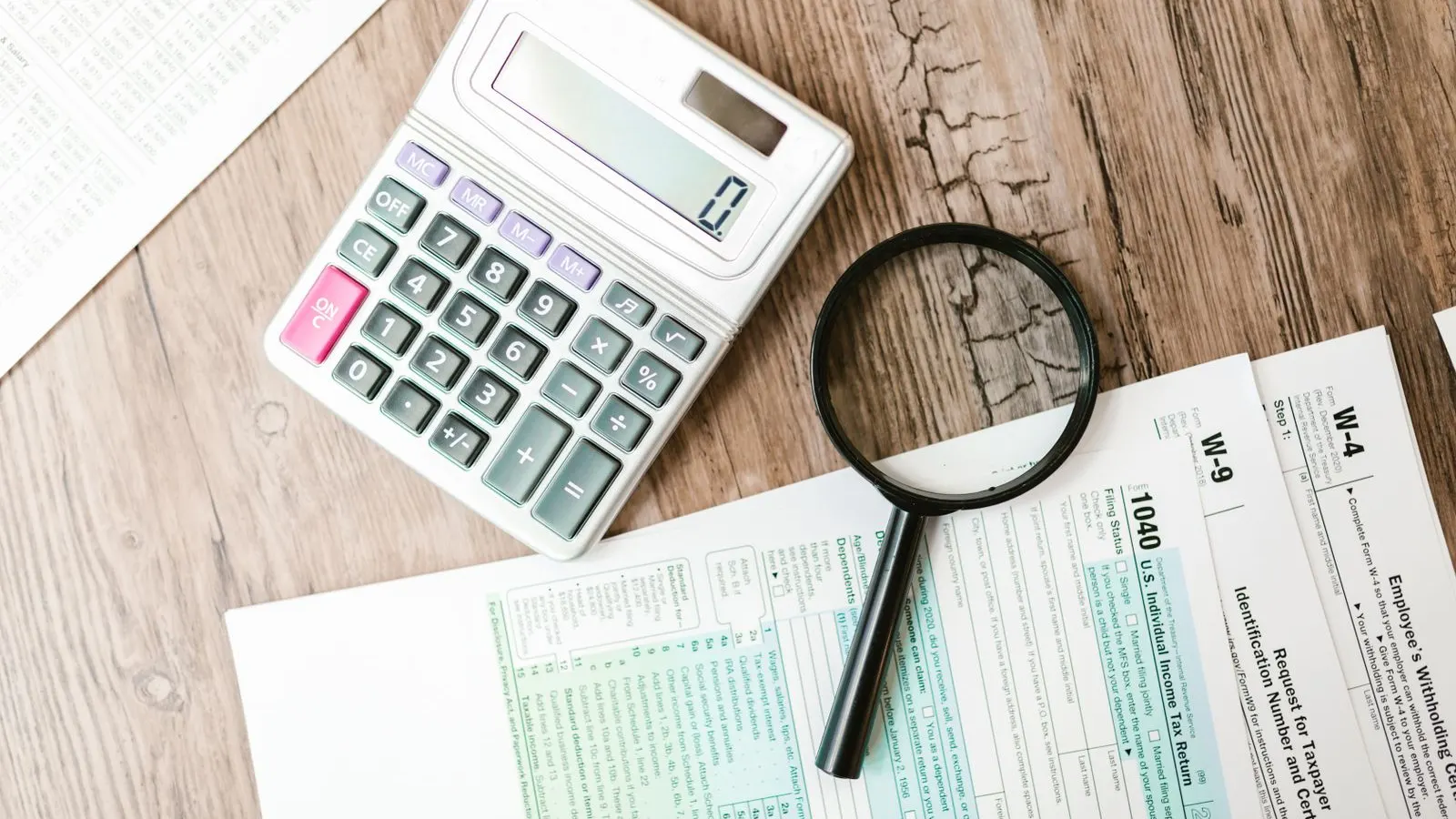Calculator and paperwork on a desk