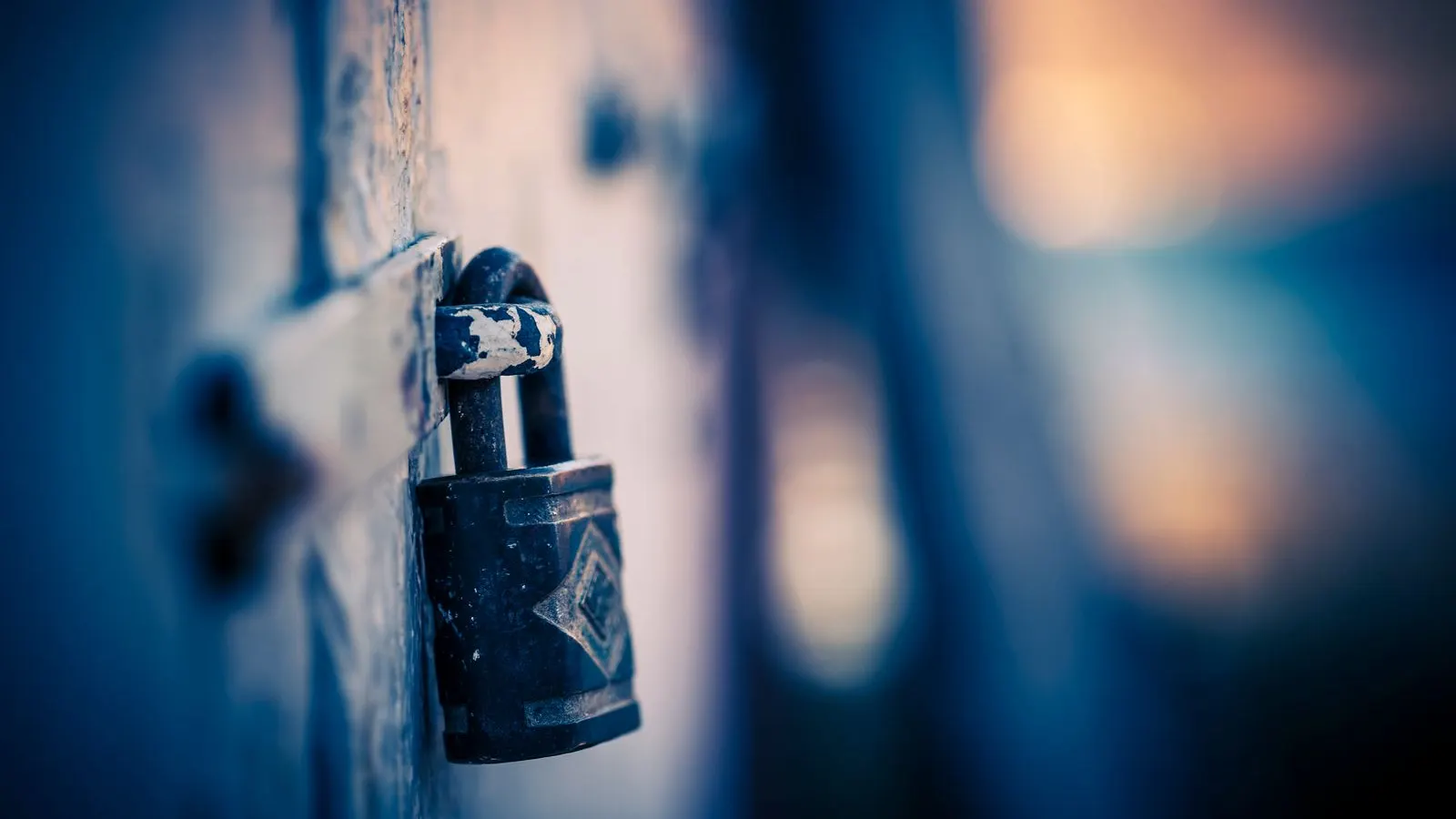 A sturdy padlock on a dark background