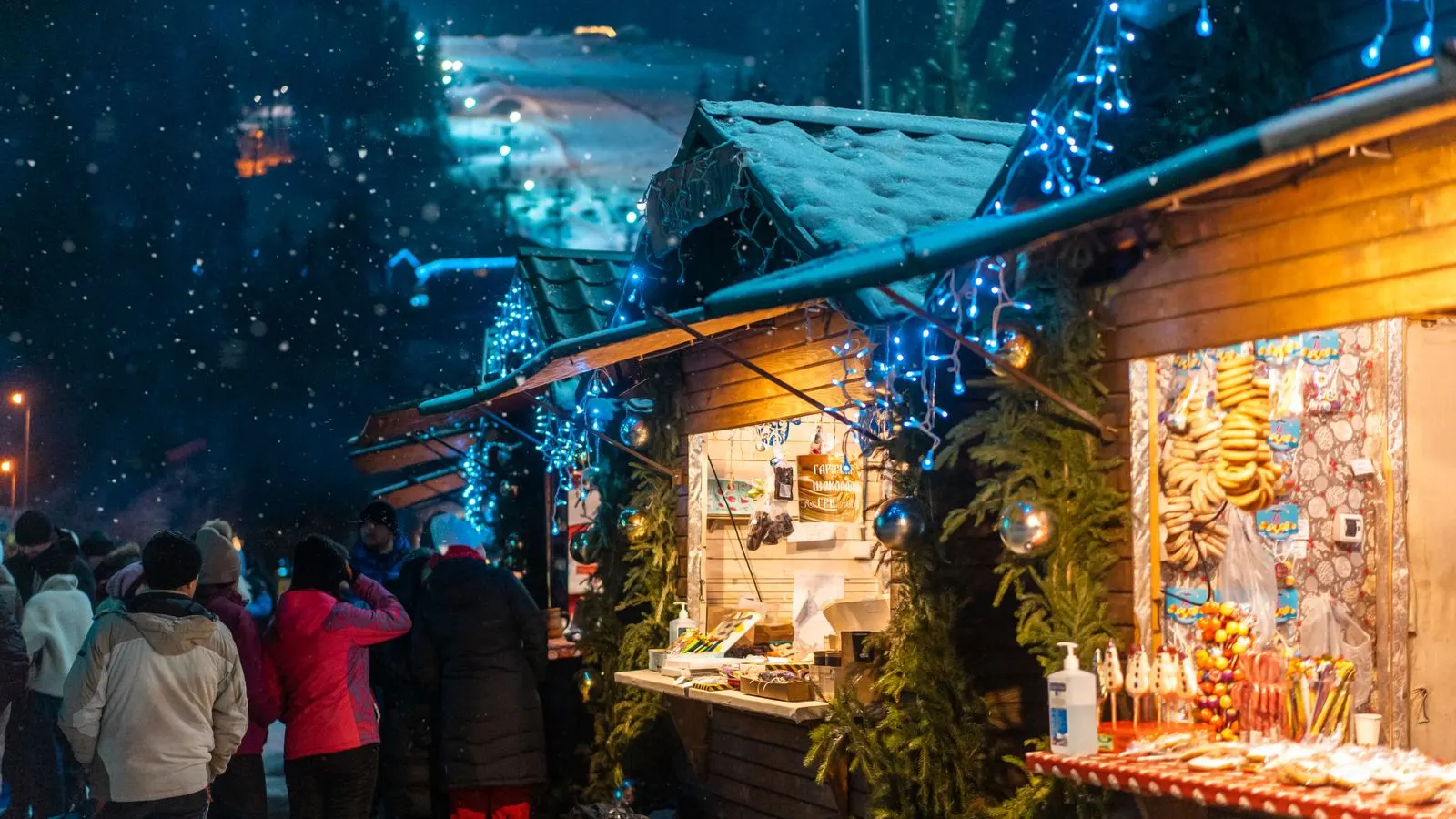 Visitors walking through a winter Christmas market