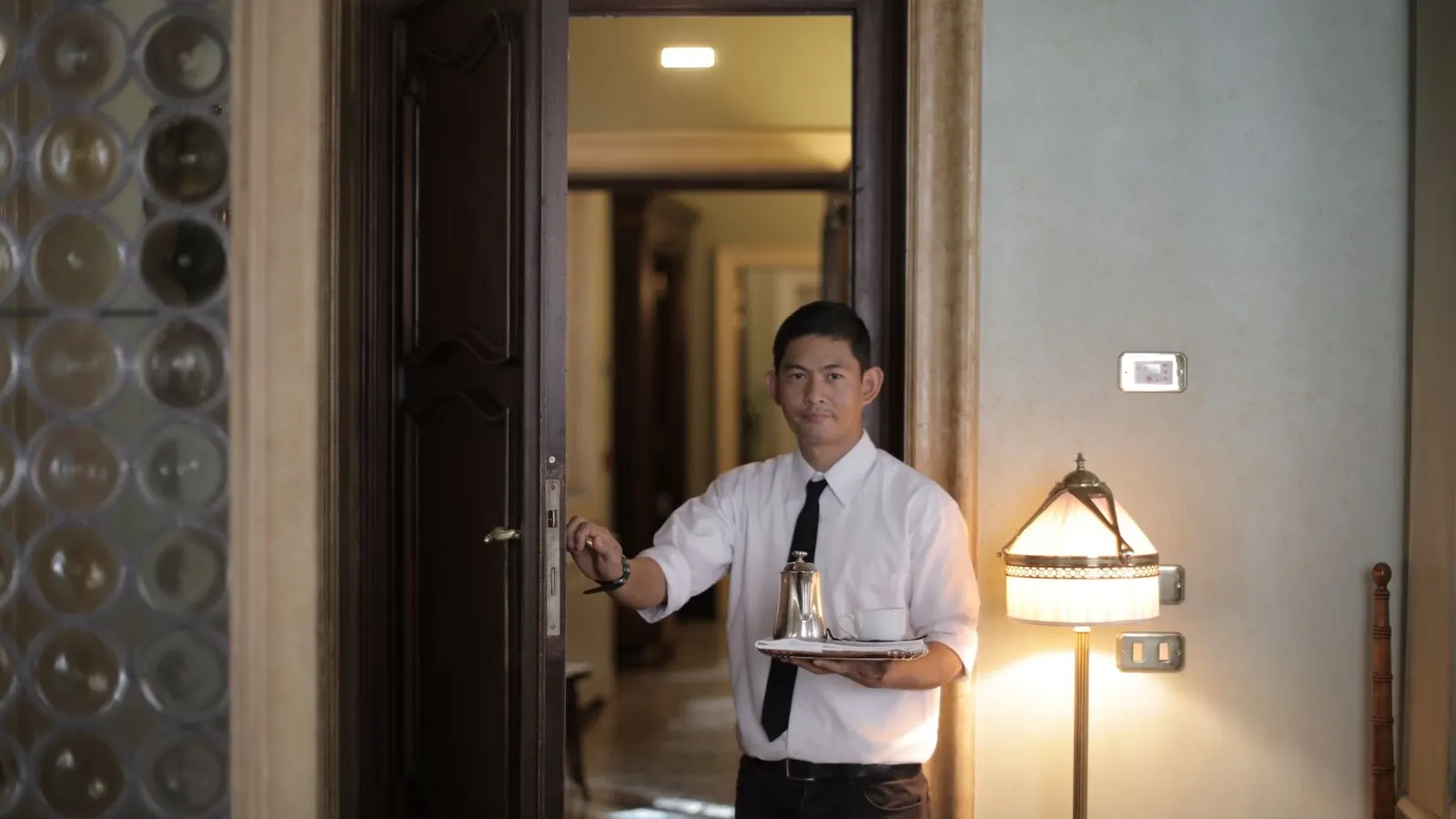 Host attending to guests at a small hotel