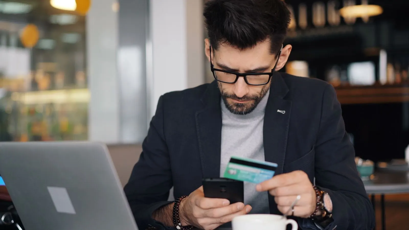 Business owner checking a card payment dispute on his phone