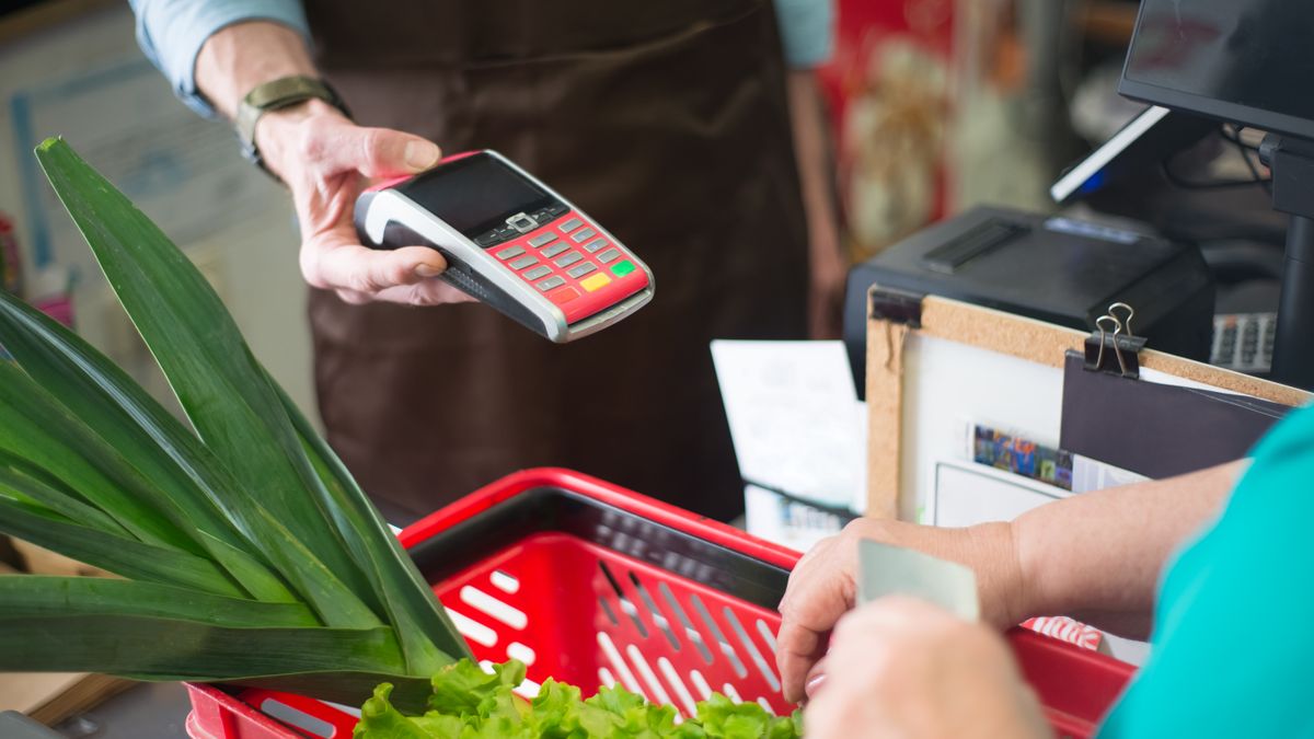 Customer paying at a restaurant counter