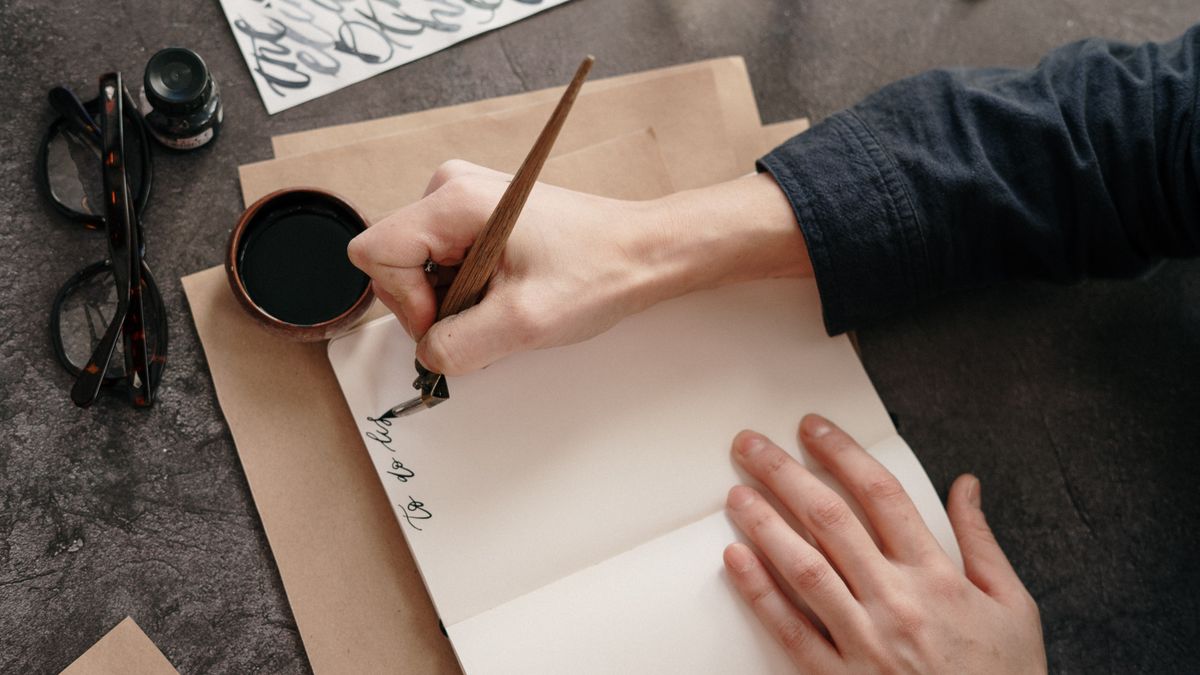 Writing a checklist on a notepad