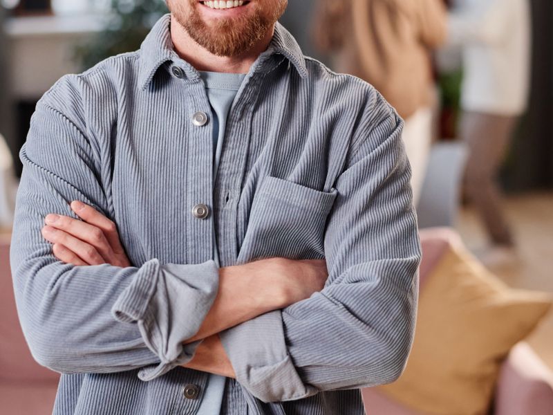 Small business owner standing confidently